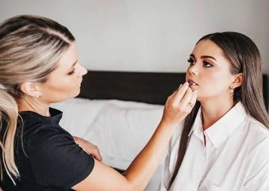 Chelsea Crocos working on a client's makeup on location in Perth